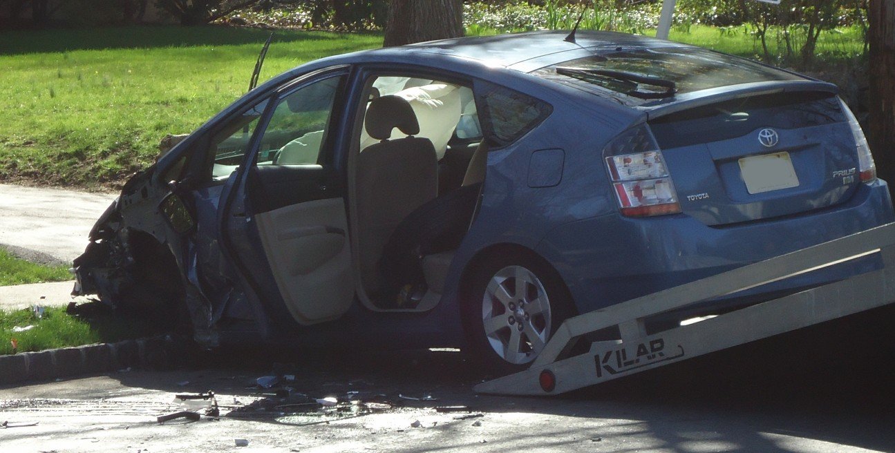 Crash scene with deployed airbags used to help determine fault