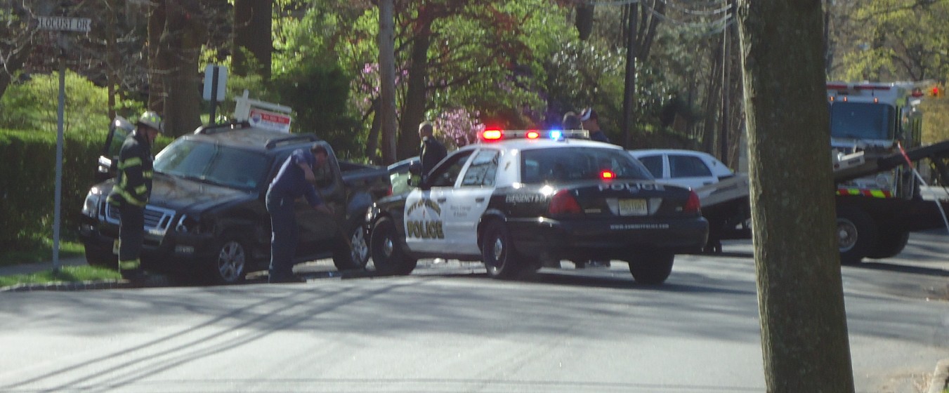 Police at a car accident scene involving an uninsured driver