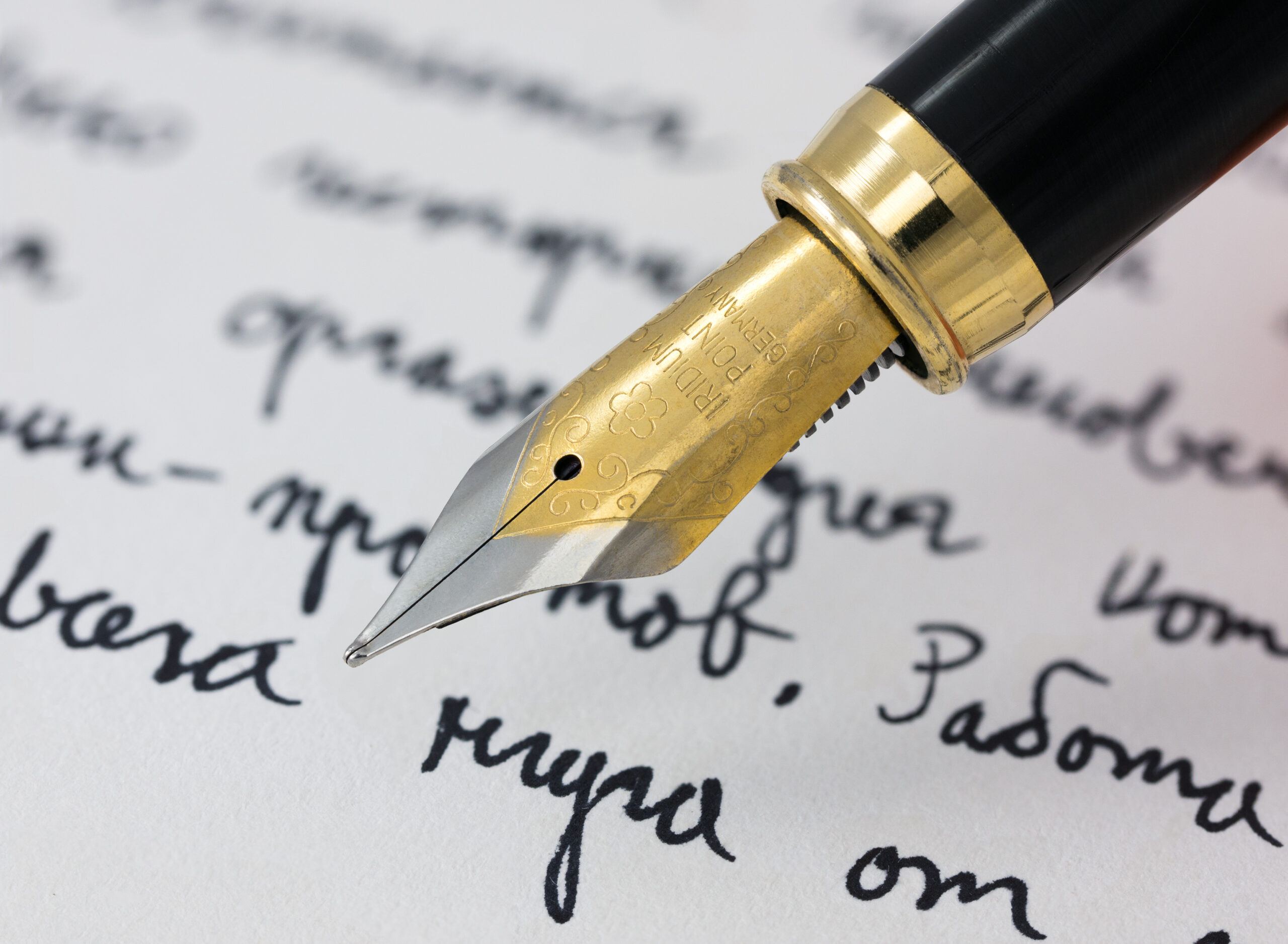 Signing a car insurance policy document at a desk